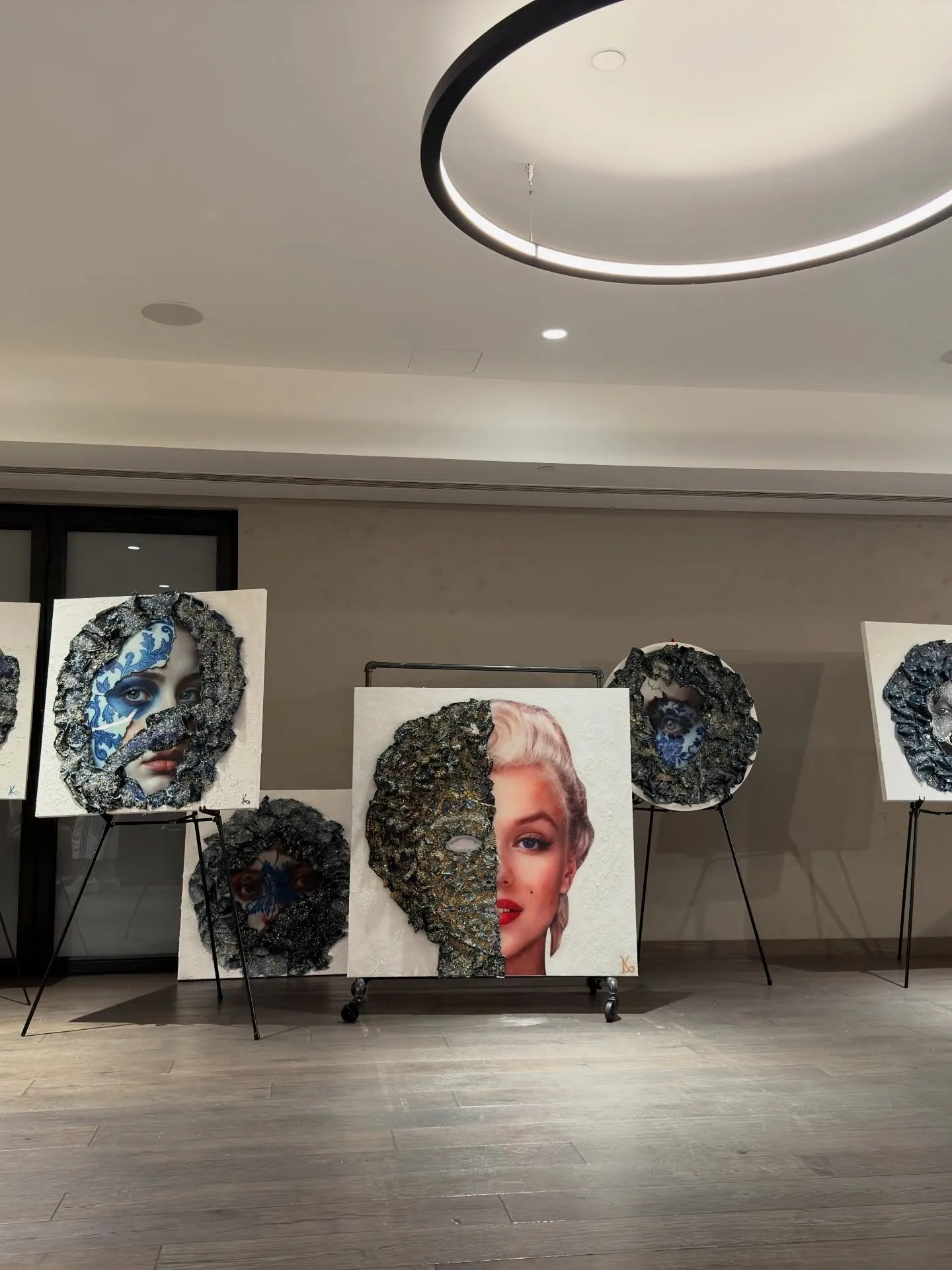 Works on easels in the exhibition room