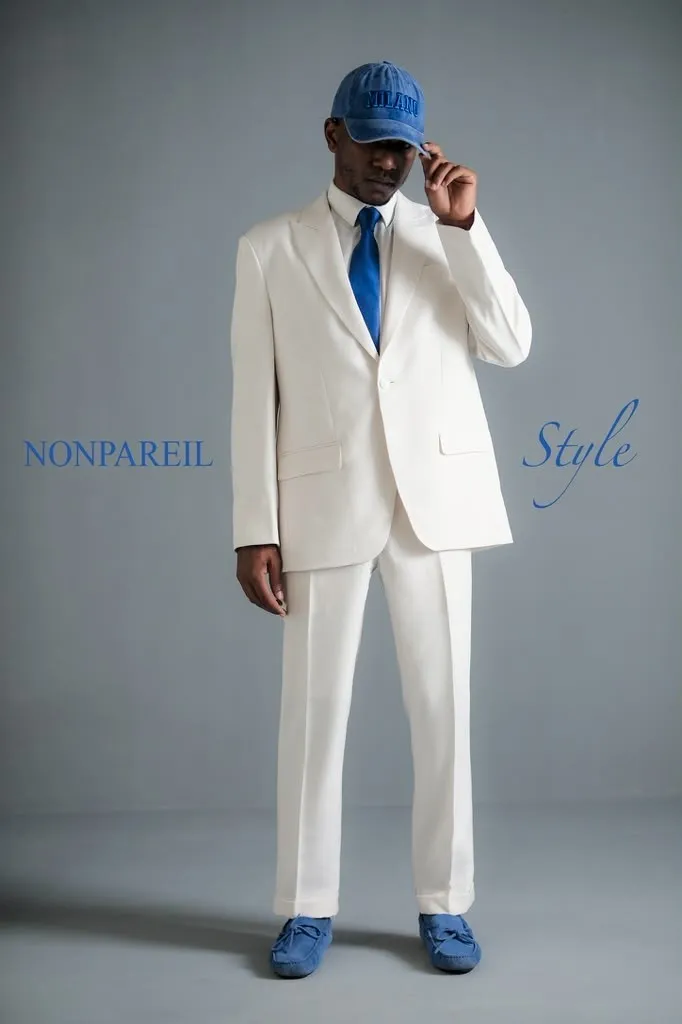 Vous Magazine, December 2025, Travon Ridley-Evans in a white NONPAREIL suit and blue cap